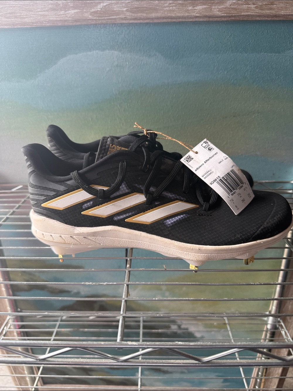 adidas Black and Gold Baseball Cleats with White Stripe Accents